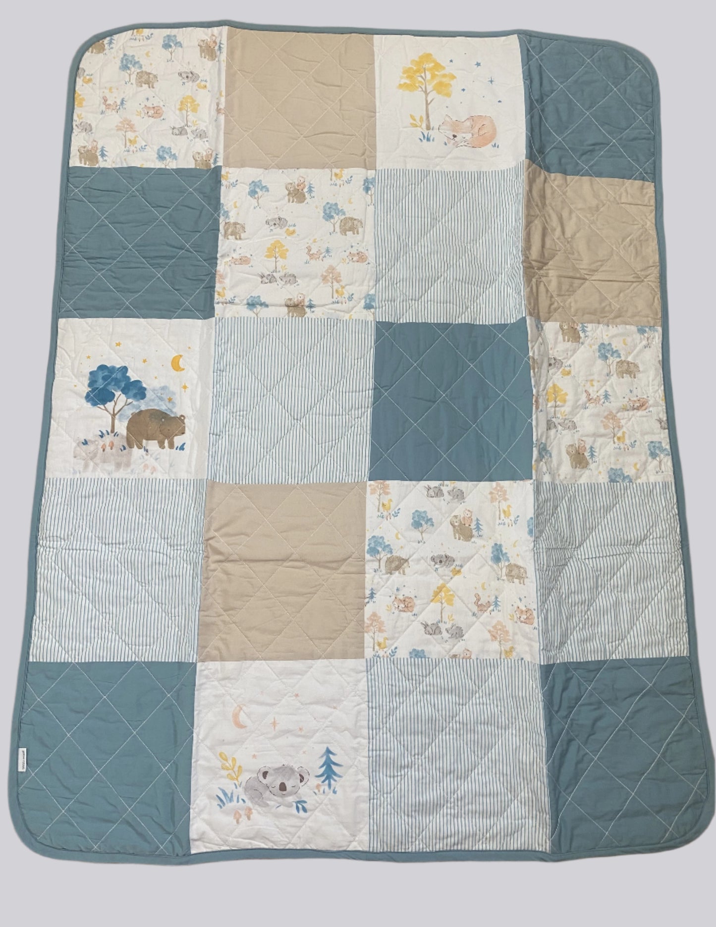 Blue quilted patchwork Reversible blanket with woodland animals print